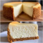 A whole baked cheesecake with a thick graham cracker crust, shown with one slice removed, highlighting the creamy texture of the cheesecake recipe.