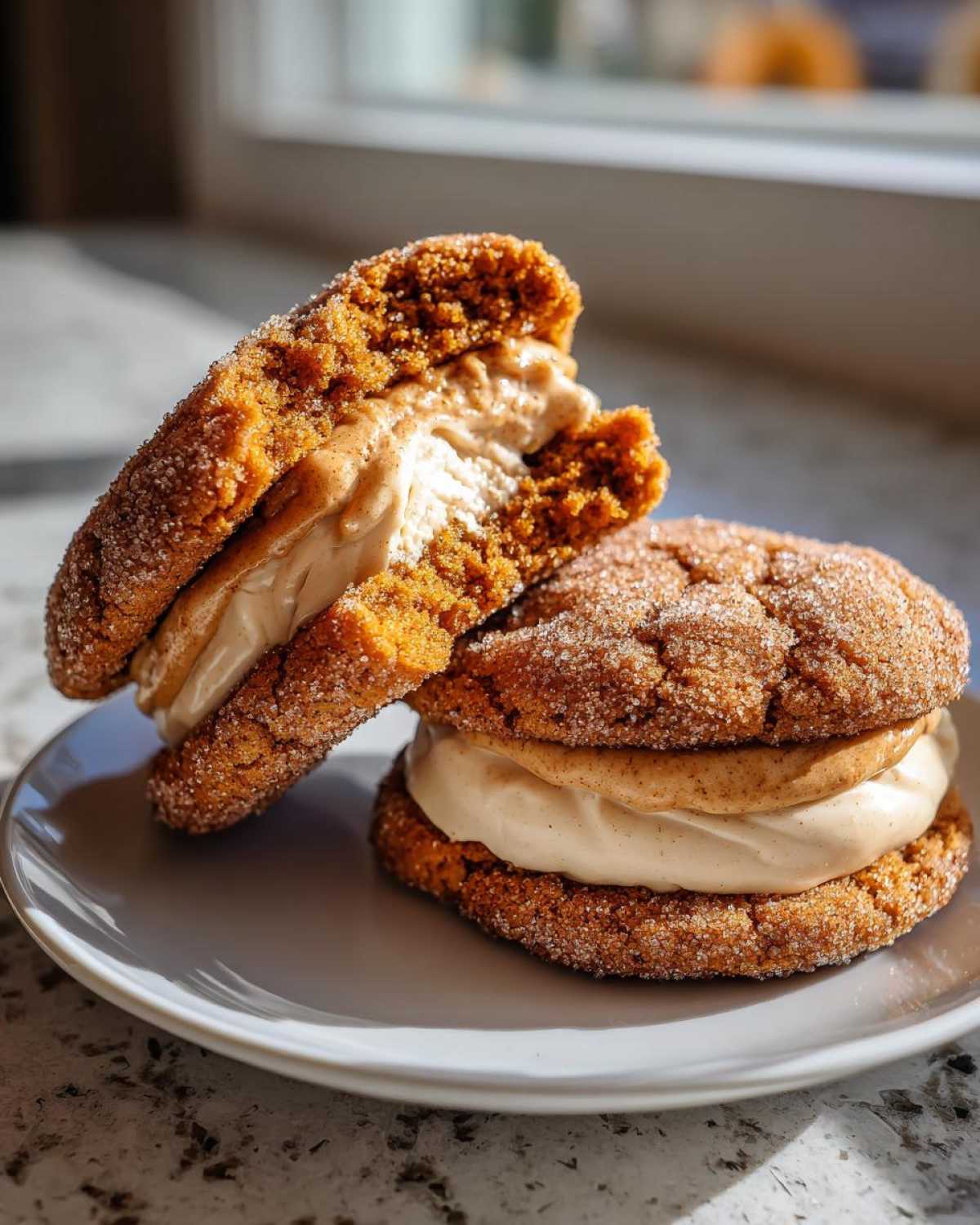 Two rich, sugar-coated churro cookies sandwiched with a thick layer of cinnamon cream filling.